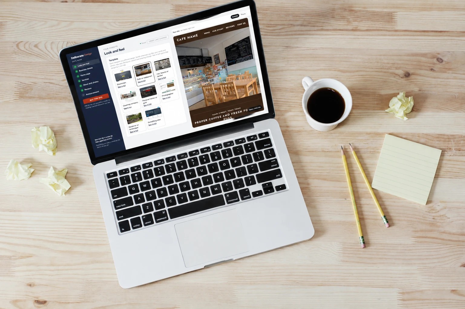 A laptop on a desk showing our website builder